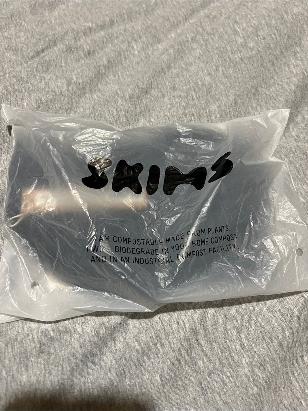 SKIMS Black Shapewear in Branded Compostable Bag